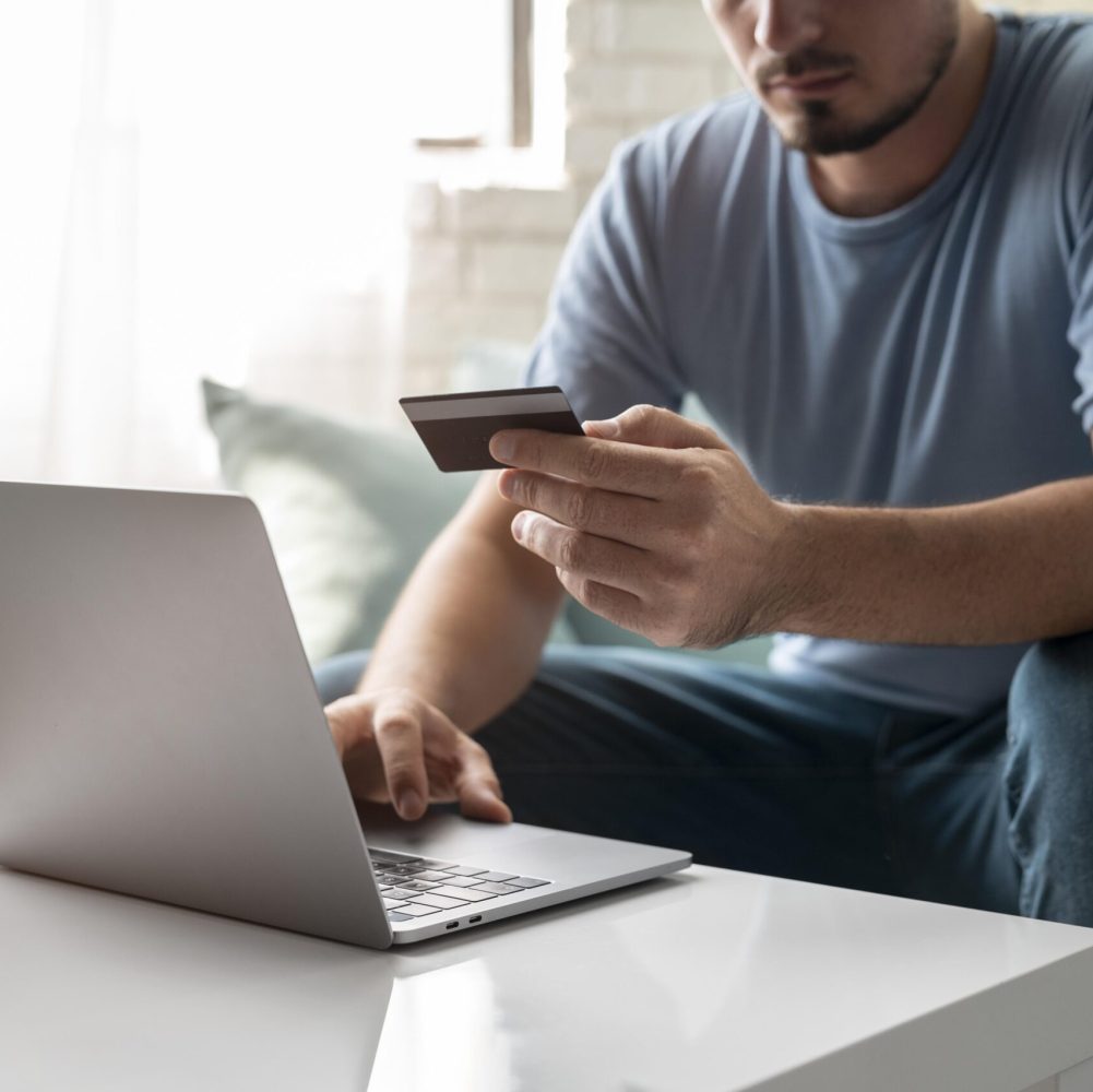 man-using-his-credit-card-play-online-order man-using-his-credit-card-play-online-order